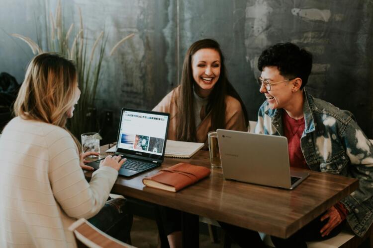 women laughing at hoe well they have developed themselves and their leadership skills while building their startups